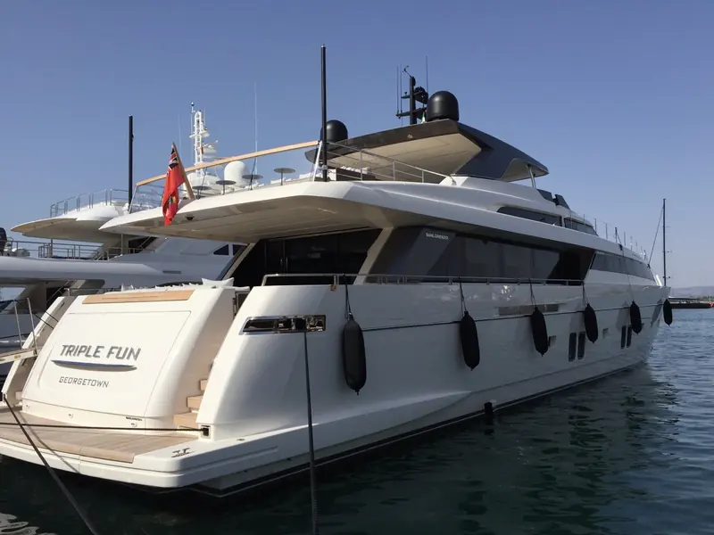 Black cylindrical Fendertex fenders line the topsides of the Sanlorenzo motor yacht Triple Fun at her berth in Palma.