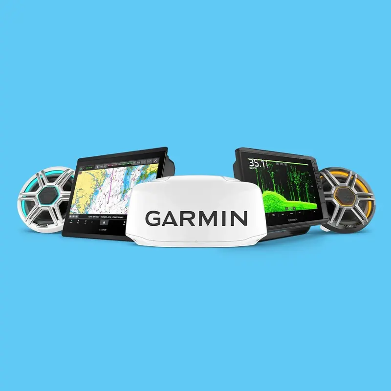 A typical Garmin marine electronics loadout: twin GPSMAP chartplotter-sounder displays flanking a GMR radar dome, with a pair of Fusion marine speakers either side.