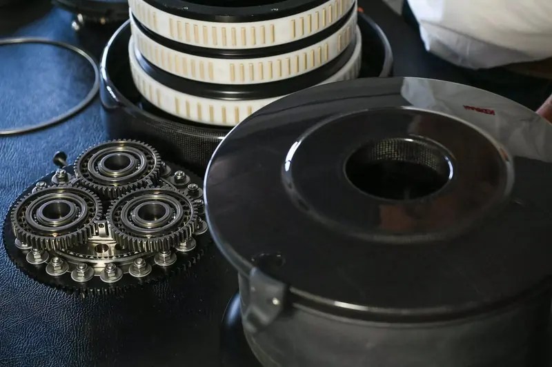 The DynaDrive's epicyclic gearbox and drum shown apart. Locating the gearing at the top of the winch frees vertical space below deck for the motor, which sits almost entirely inside the drum.