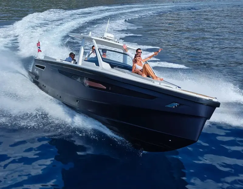 A Windy sportboat on the plane with guests aboard: a builder-fit customer for interceptor trim control, keeping the bow down and the ride flat as the throttle opens.