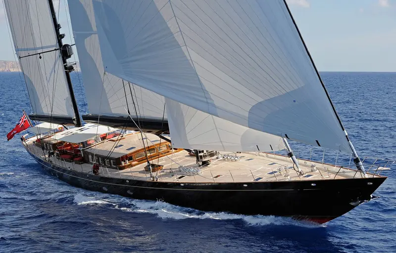 The sailing superyacht Marie under full canvas; her captain fitted a single Intellian v100NX with a 25W BUC on the mizzen rather than two smaller antennas, to keep the weight and windage off the mast.