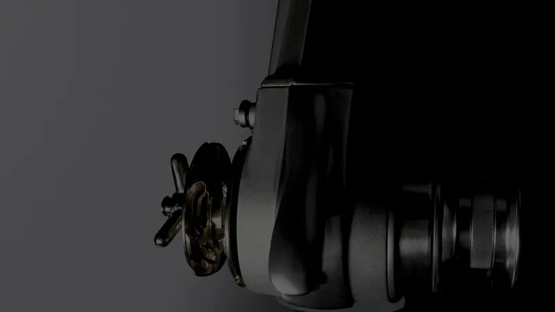 A Lofrans horizontal windlass in studio light, the bronze manual-override wheel and chain gypsy visible at the drum end.