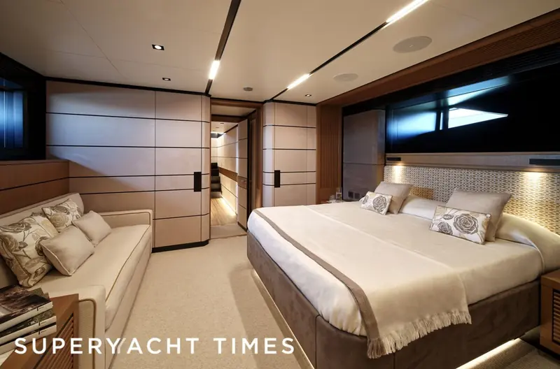 A guest stateroom finished with Loro Piana bedspreads and wall panels, the private end of the boat the house is chosen for.