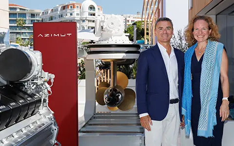 Rolls-Royce and Azimut Benetti Group representatives beside an mtu engine and ZF pod drive on display, at the signing of their yacht propulsion partnership, September 2024