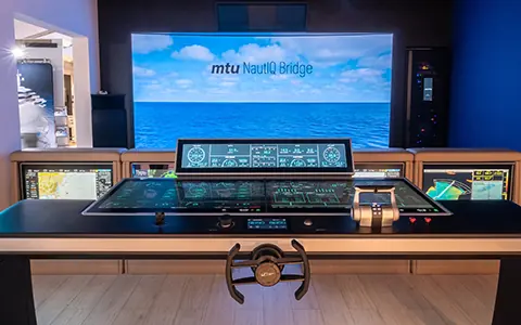 The mtu NautIQ Bridge integrated helm console on display, combining propulsion, navigation and energy management in one system