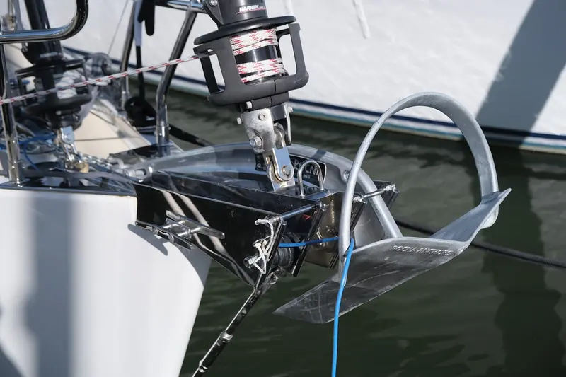 A Rocna Mk II on its bow roller, showing the roll bar, high-tensile shank and concave fluke that define the design
