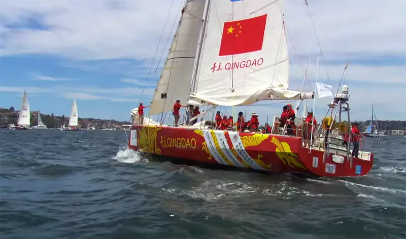 The yacht Qingdao under spinnaker at the start of the Rolex Sydney Hobart, one of the fifteen international events the brand has sponsored since 2002.