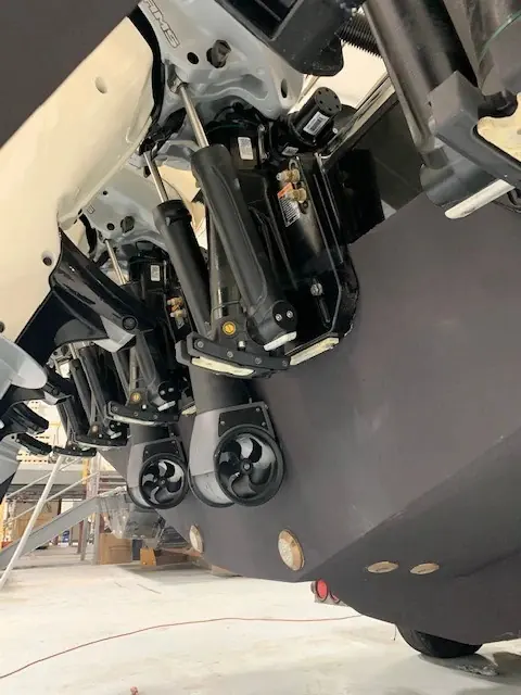 External and retractable thruster units mounted to a transom during a haul-out refit, the two thruster types Sleipner builds for boats too thin in the bow for a tunnel.