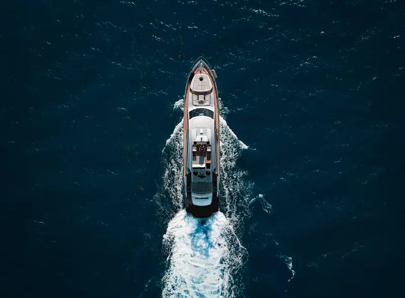 A planing motor yacht under way, shot from directly overhead; this is the lead image on Starlink's own maritime product page, used to sell the service to private and charter yacht owners.