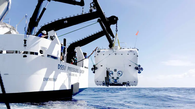 Triton's full ocean depth submersible, built for Victor Vescovo's Five Deeps Expedition, is craned off the support ship DSSV Pressure Drop ahead of a dive.