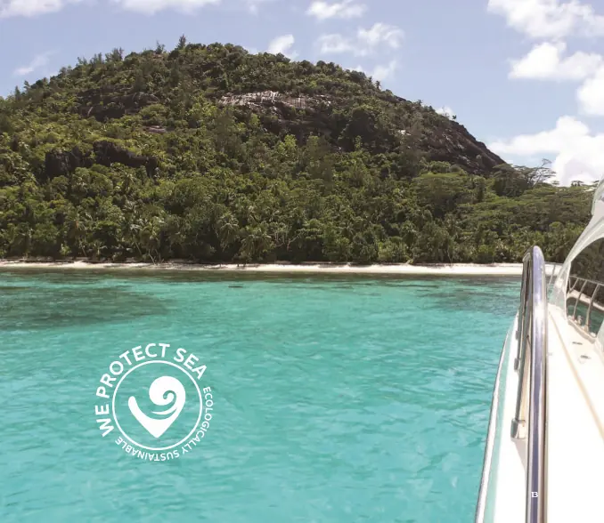 A yacht's bow approaching a tropical anchorage, the kind of setting an owner buys an Ultra anchor for.