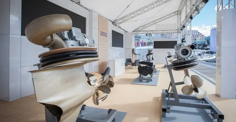 IPS pod drives and propellers on display at a Volvo Penta stand - the forward-facing counter-rotating props that set the system apart from a shaft and rudder.