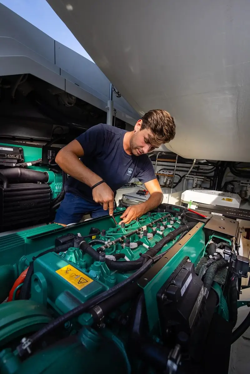 A Wajer engineer works on one of the Volvo Penta diesels in the engine bay.