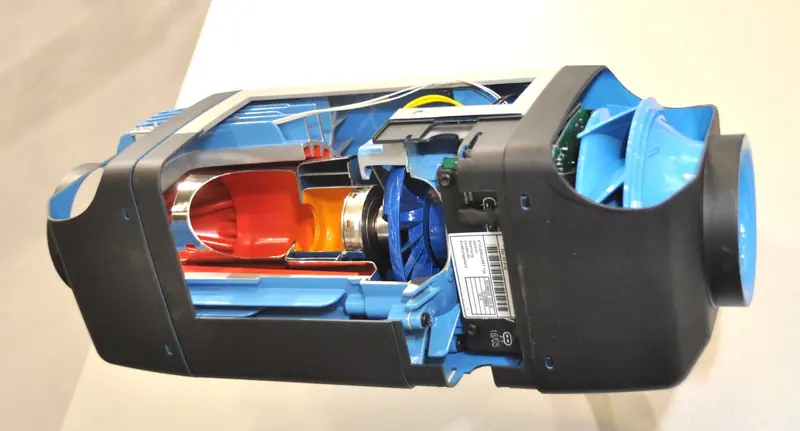 A second angle of the cutaway Air Top forced-air heater showing the blower wheel and heat exchanger surface that separates the exhaust gases from the outgoing warm air stream