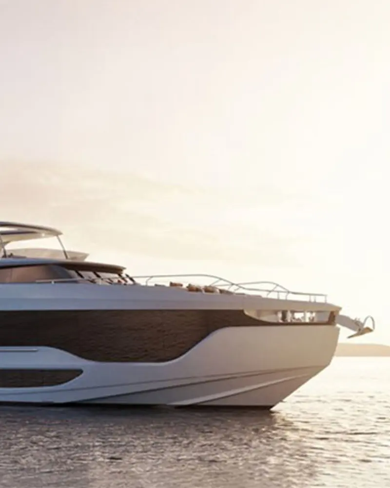 A flybridge motor yacht fitted with ZF's POD4600 drive line at anchor in golden evening light, swim platform lowered and tender davit swung out at the transom