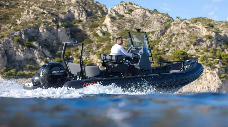 A Zodiac Medline cruising a rocky Mediterranean coastline, the range built for owners using a tender as a day boat rather than only ship-to-shore transport.