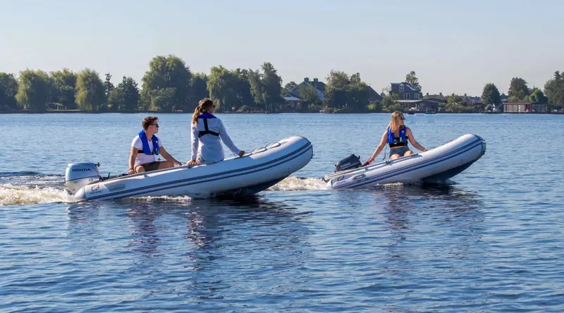 Two Zodiac tenders on a lake, the compact CADET-style RIBs that make up the bulk of the brand's yacht-tender volume.