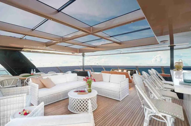 A second deck lounge area, one of multiple distinct outdoor zones the catamaran's beam makes possible.