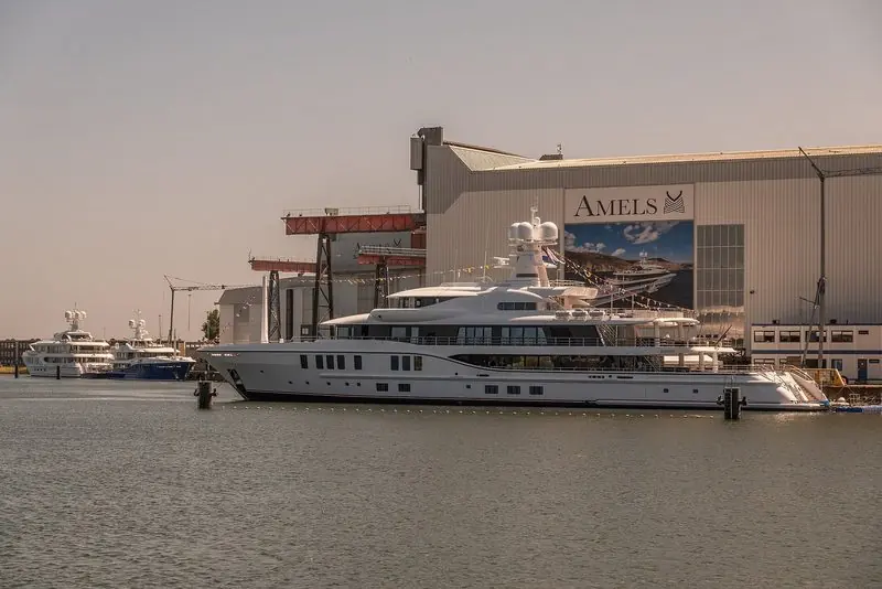 Bunting is up at the Amels hall in Vlissingen, with a finished yacht on the quay.