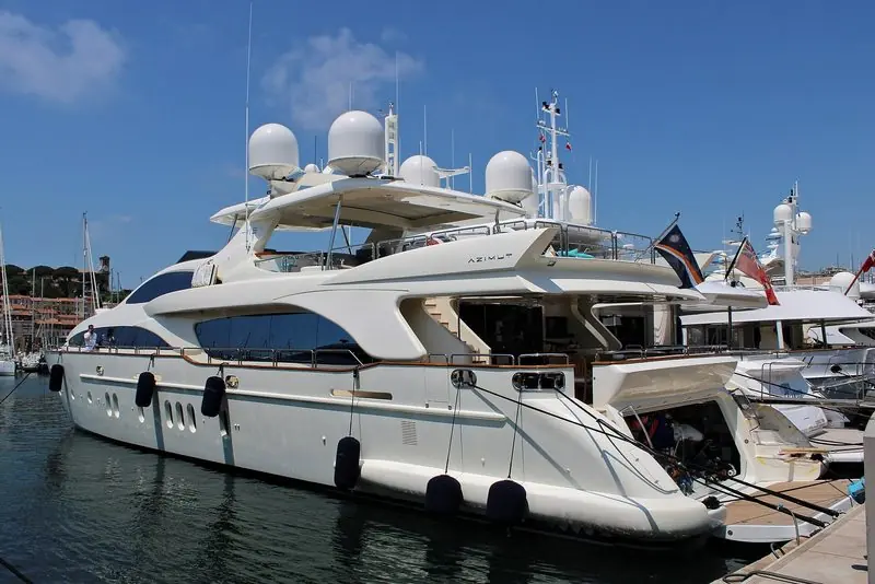 An Azimut lies stern to in Cannes in a row of flybridge yachts.