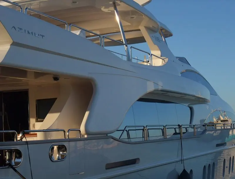Evening light picks out the sculpted side decks and the builder's name on a 35 metre Azimut.