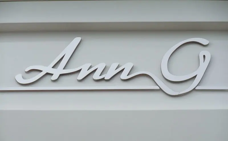 The yacht's name is cut in polished script and set on the white superstructure.