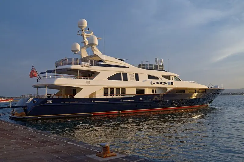 The Benetti motor yacht Jo with a deep blue hull moored at the quay in Syracuse, Sicily