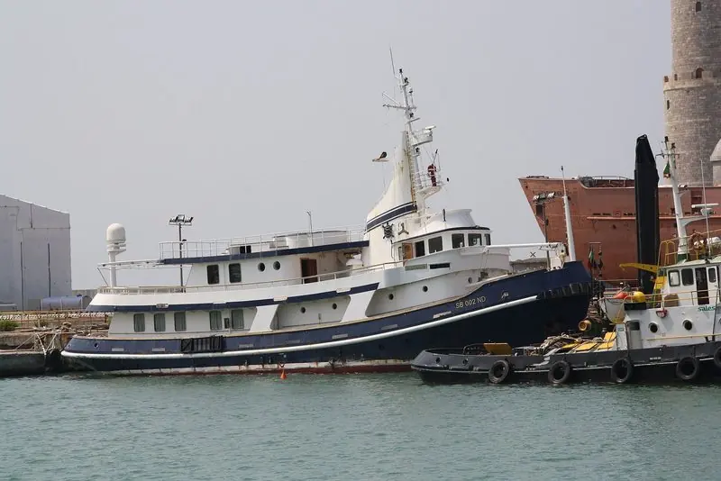 The 1962 Benetti-built motor yacht Mistral moored in Livorno with a tug alongside