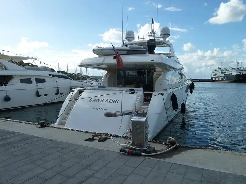 Stern view of motor yacht Sans Abri moored stern-to at the quay in Casamicciola