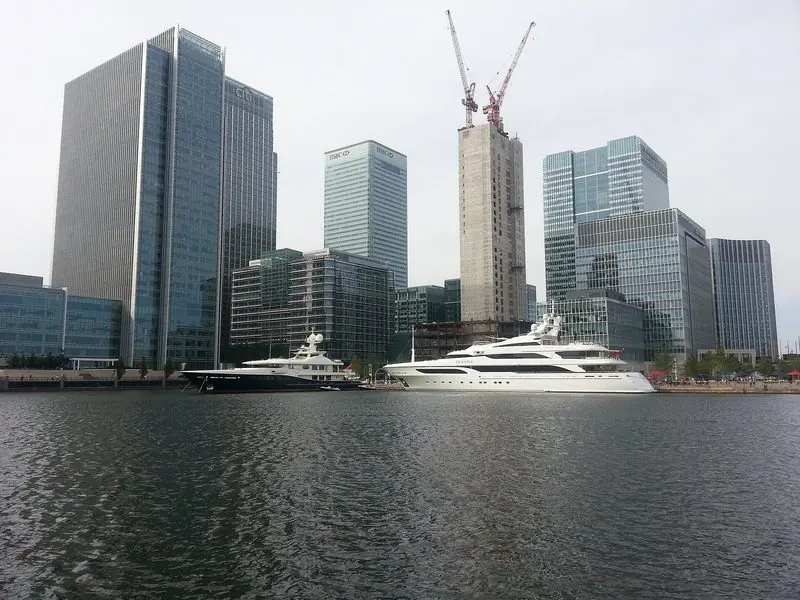 Superyachts moored beneath the towers of Canary Wharf in London, with the motor yacht Seanna in the foreground